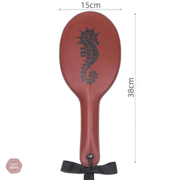 Impact paddle : instrument de plaisir et de douleur contrôlée