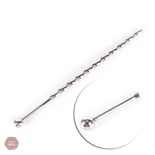 Dilatation urétrale avec plug à perles décoratives